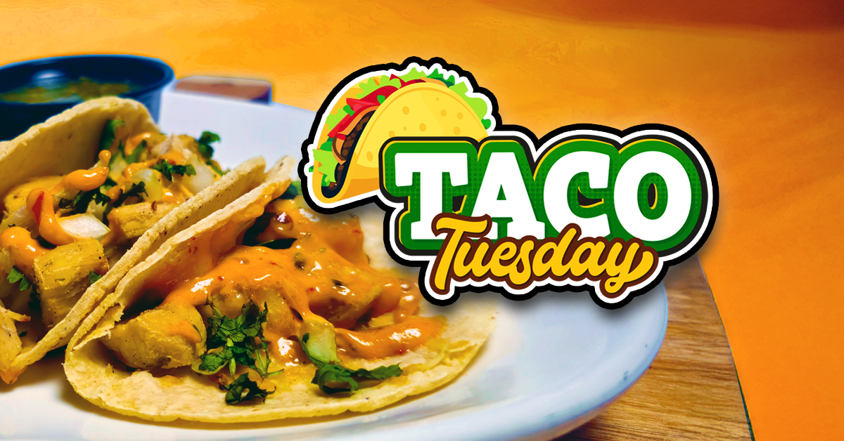 This image is designed to promote a “Taco Tuesday” event or special. It features two appetizing tacos filled with seasoned meat, diced onions, fresh cilantro, and a drizzle of orange sauce, placed on a white plate. The vibrant “Taco Tuesday” text is bold and colorful, with a playful taco graphic above it, making it eye-catching and fun. The bright orange and green color scheme enhances the festive, appetizing appeal and draws attention to the promotion. Overall, it serves as a visual invitation to enjoy tacos on a Tuesday, likely at a restaurant or special event.