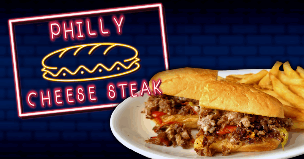 This image is designed as a promotional advertisement for a Philly Cheese Steak meal. It features a brightly lit neon-style sign that reads “Philly Cheese Steak,” accompanied by an illustration of a sandwich, evoking a diner or restaurant feel. In the foreground, there’s a plate with a Philly Cheese Steak sandwich and fries, making the food look appetizing and freshly served. The dark blue brick background helps the neon sign and food stand out, drawing the viewer’s attention to the featured dish. Overall, the image aims to attract customers and promote the sandwich as a tasty menu option.